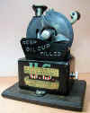 US_Auto_Oil_Cup_front_OMS.JPG (41292 bytes)